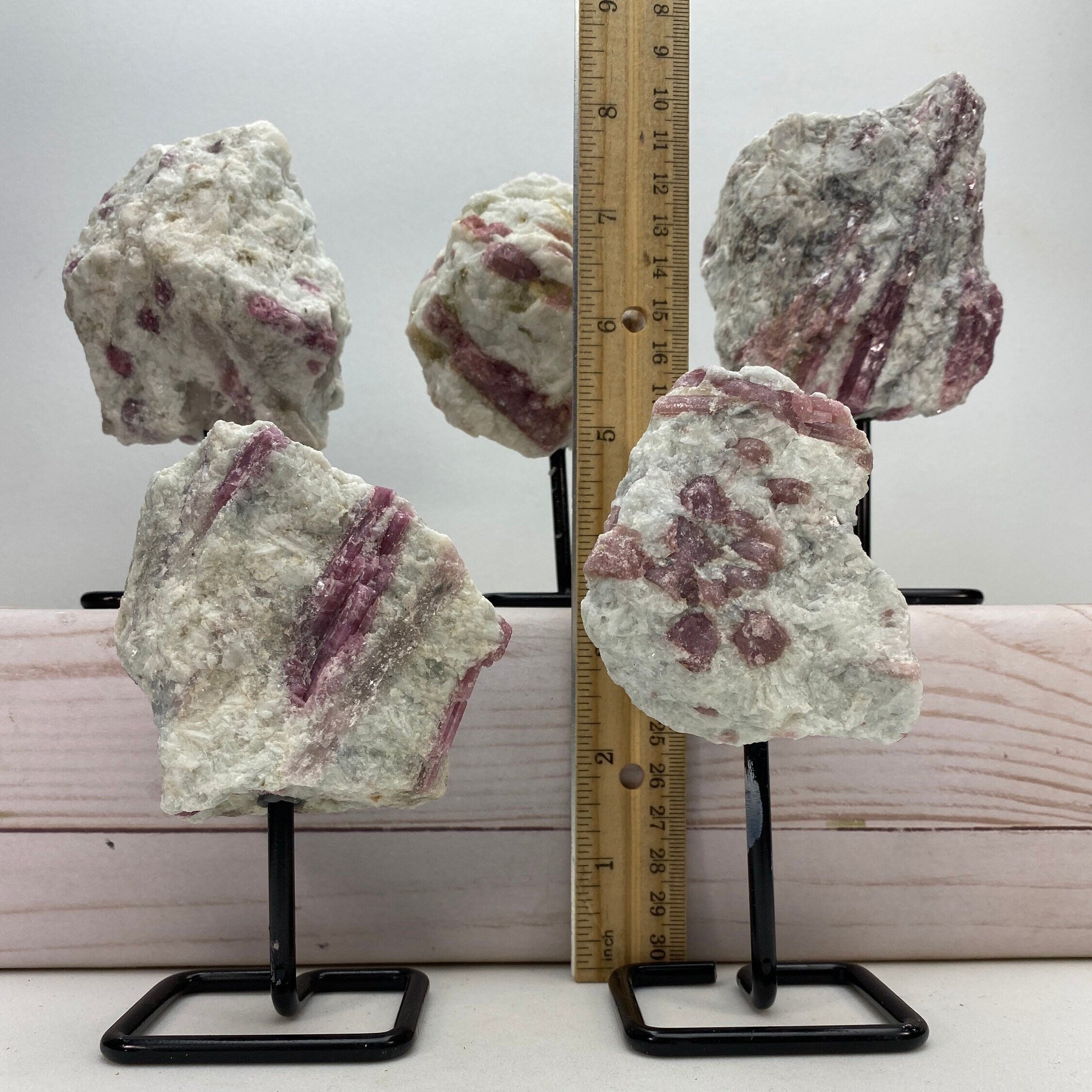 Pink tourmaline on a metal stand