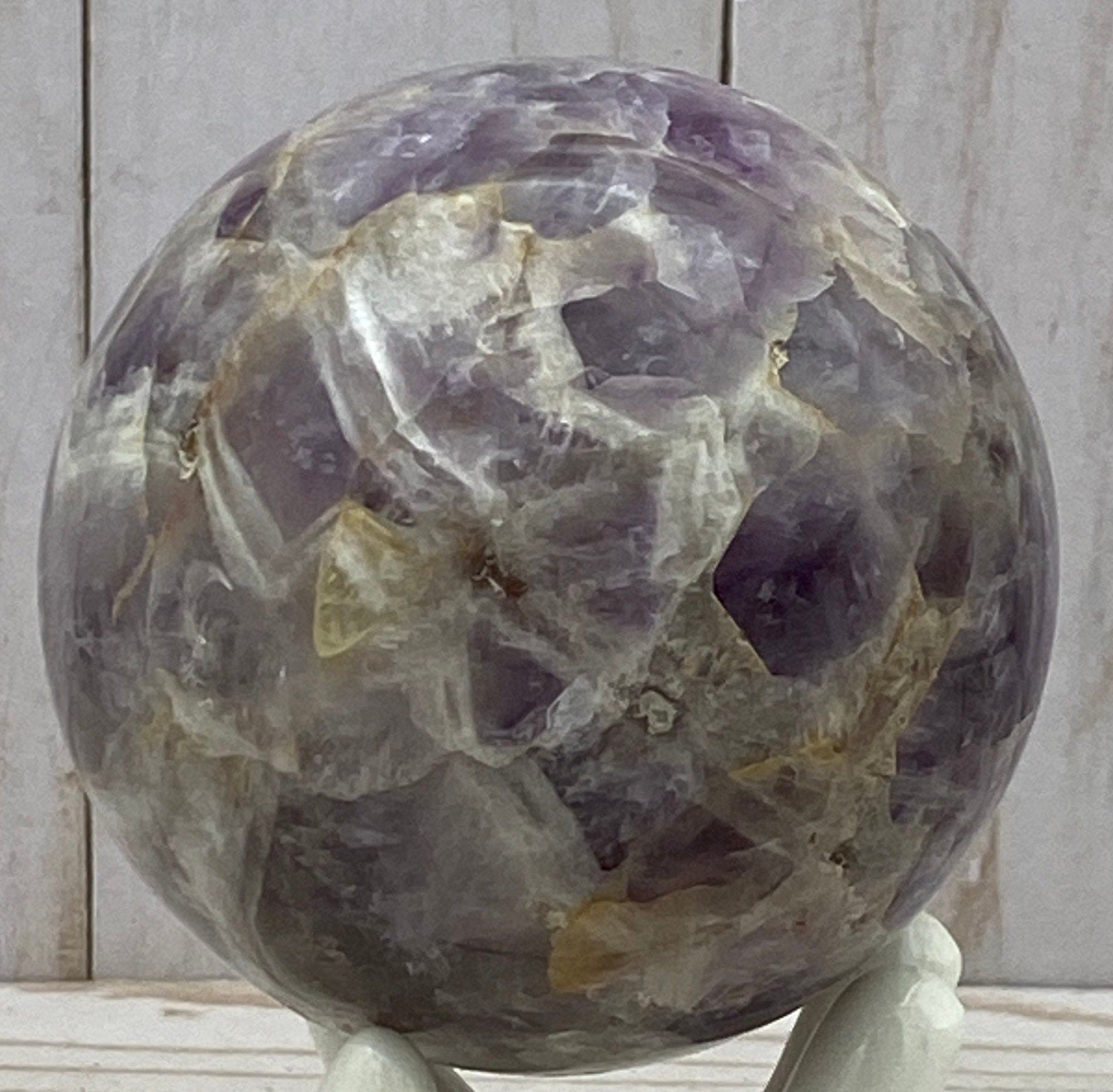 Amethyst sphere in acrylic stand