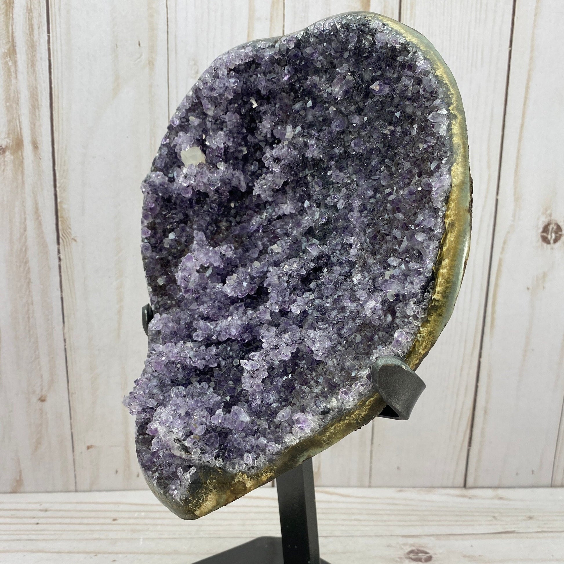 Amazing amethyst cluster in metal stand
