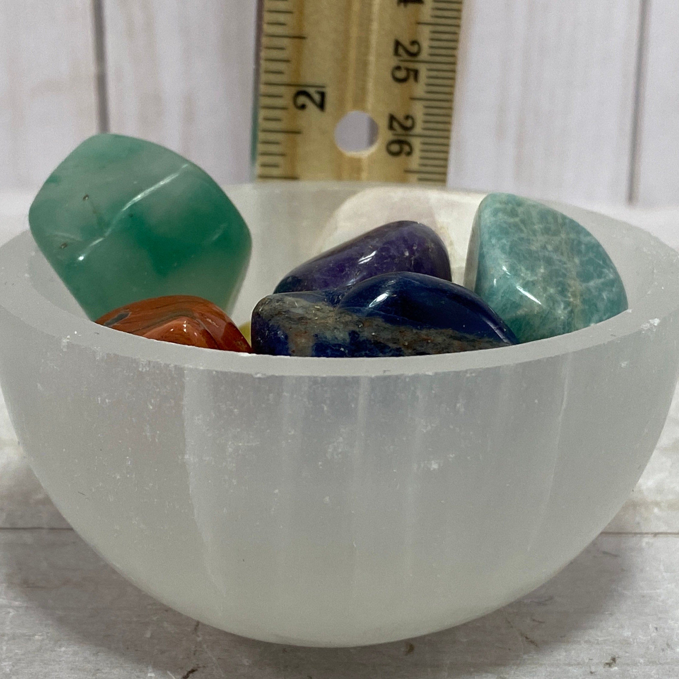 Chakra stones in a Selenite charging bowl