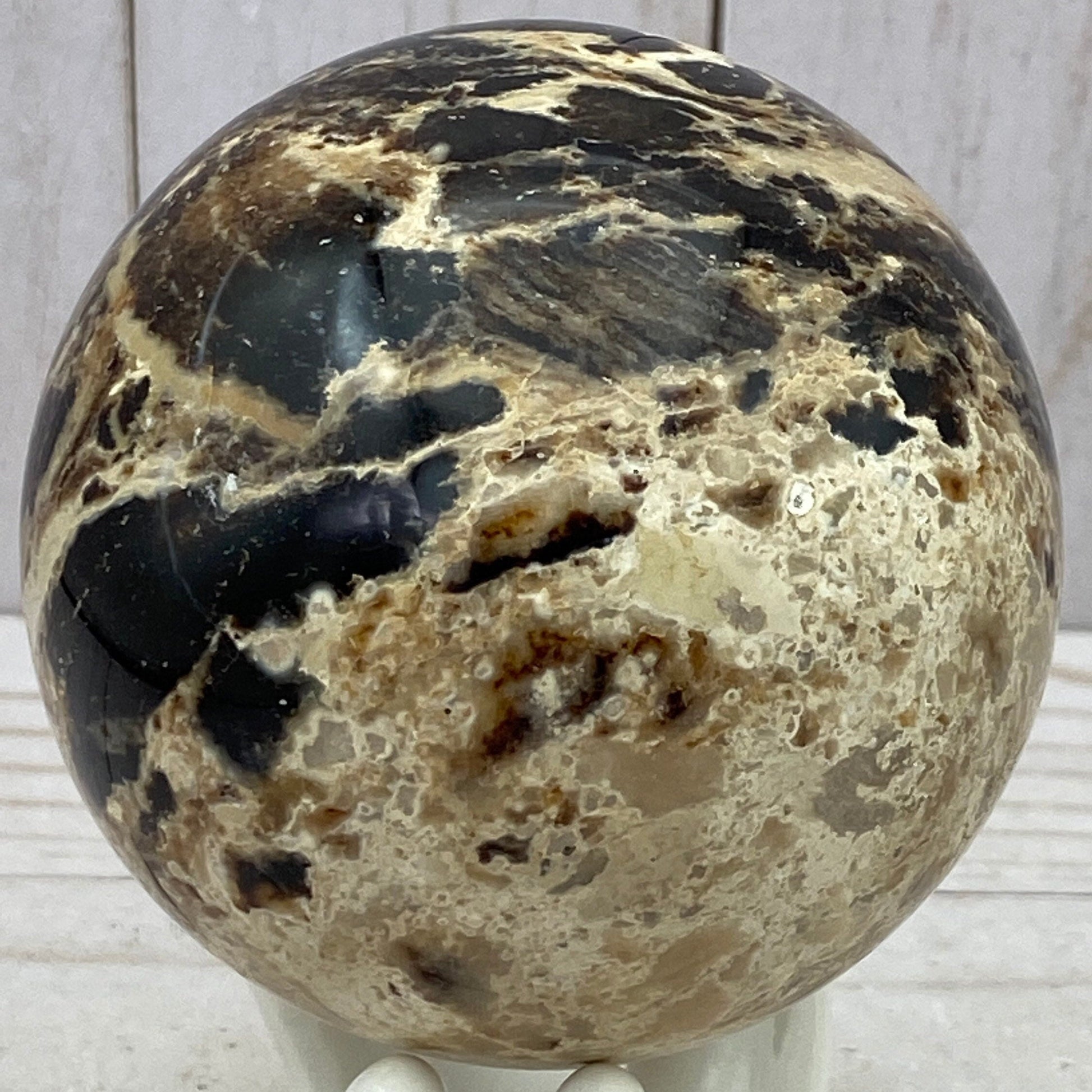 Black opal sphere in acrylic stand