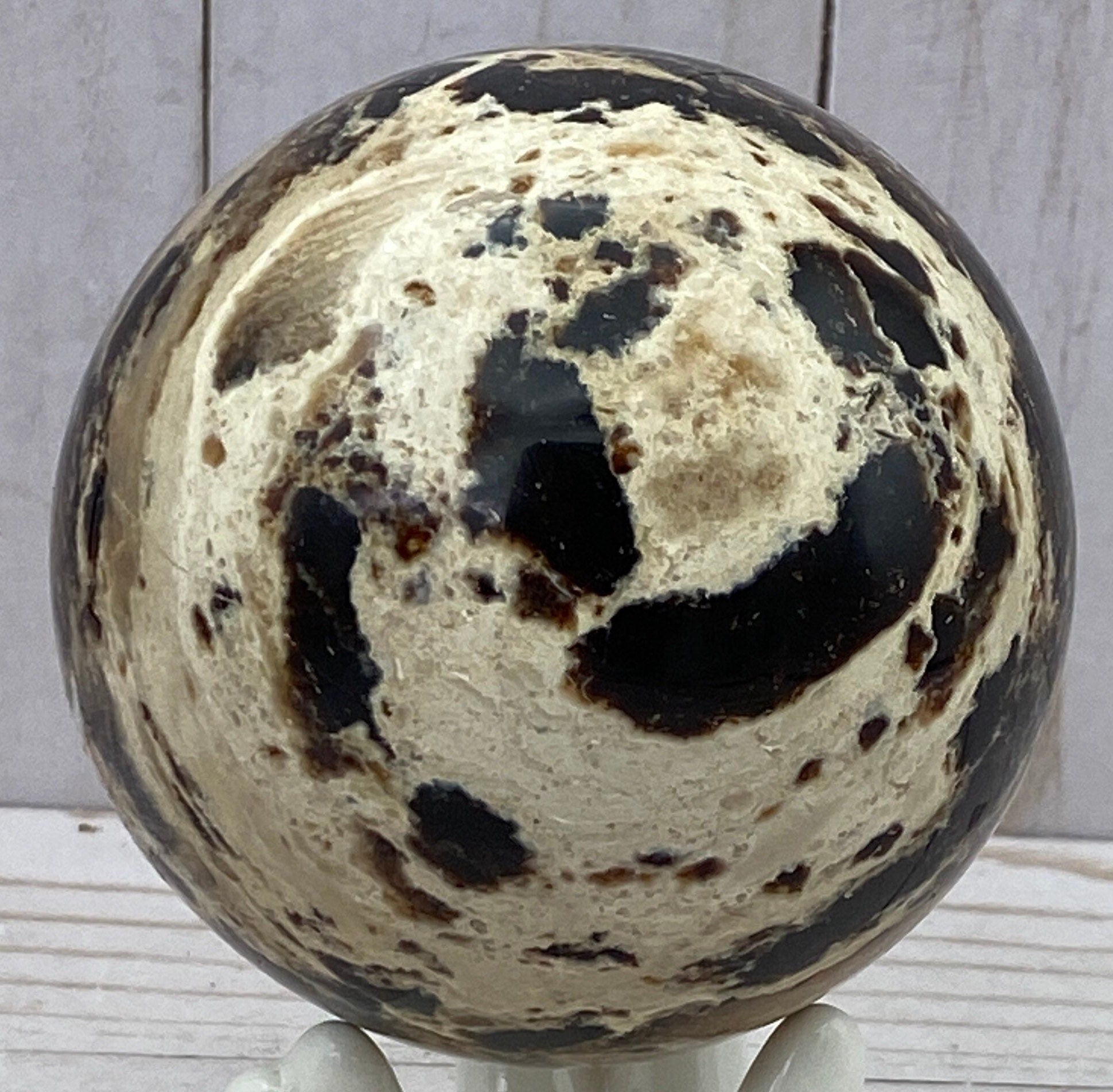 Black opal sphere in acrylic stand