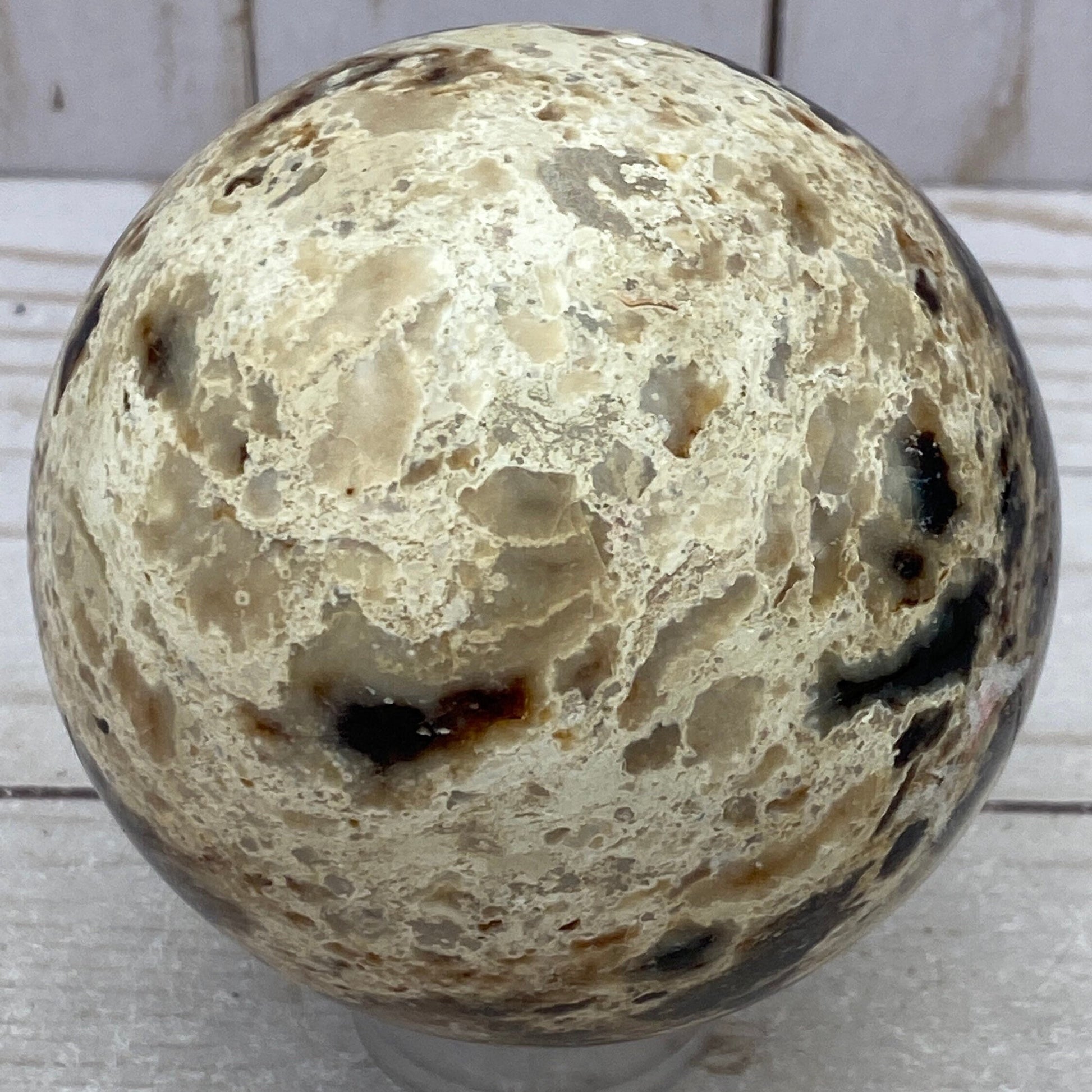 Black opal sphere in acrylic stand