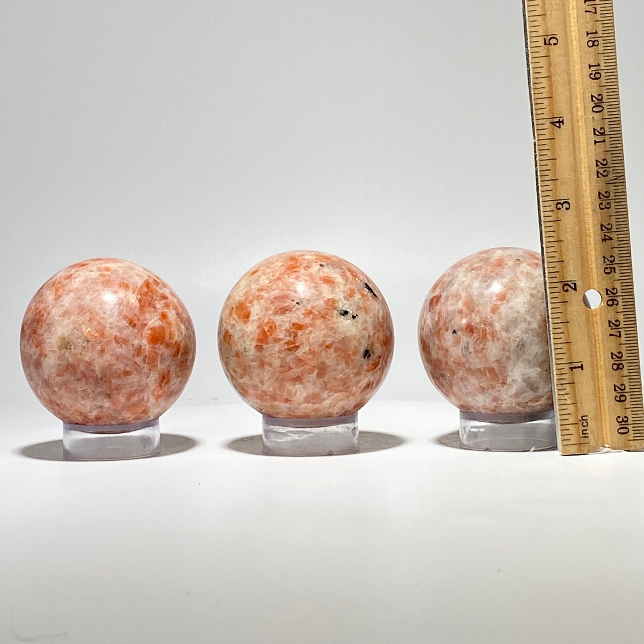 Sunstone sphere in acrylic stand