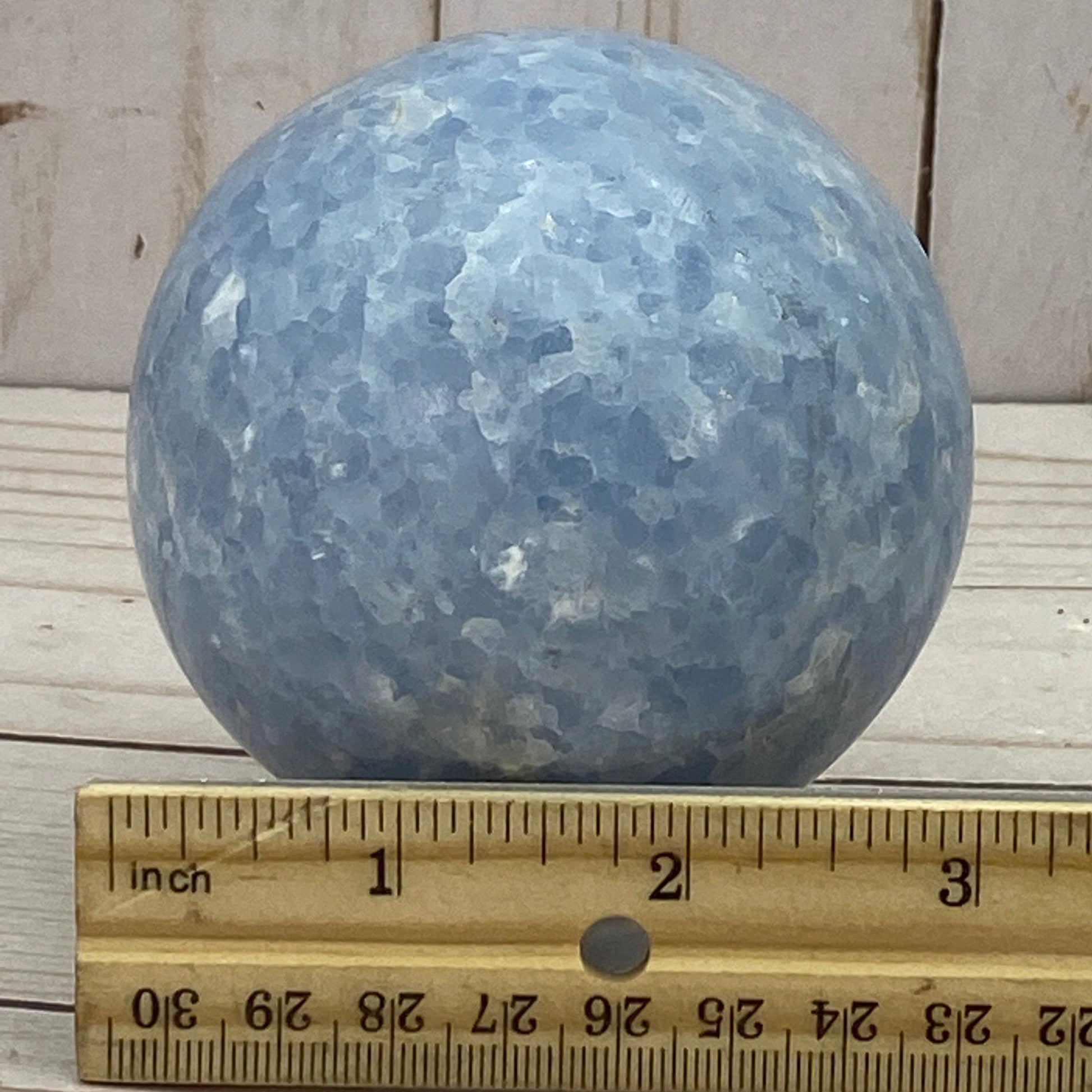 Blue calcite sphere in stand